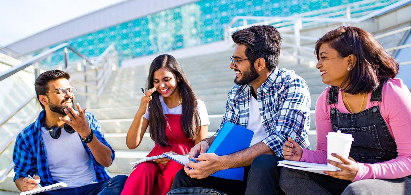 Students chatting on campus steps